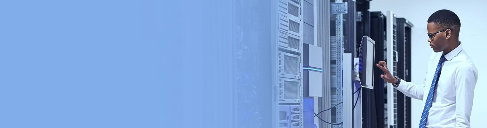 An image of an engineer using a touch screen interface in a data center