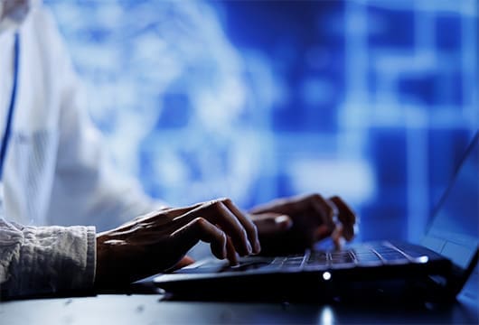 Man Typing On Computer