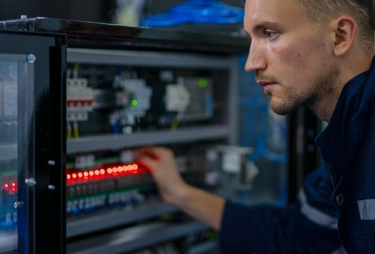 An image of a male engineer inspecting equipment