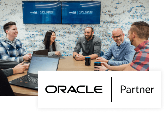 An image of Service Express employees around a table with Oracle | Partner logo overlayed