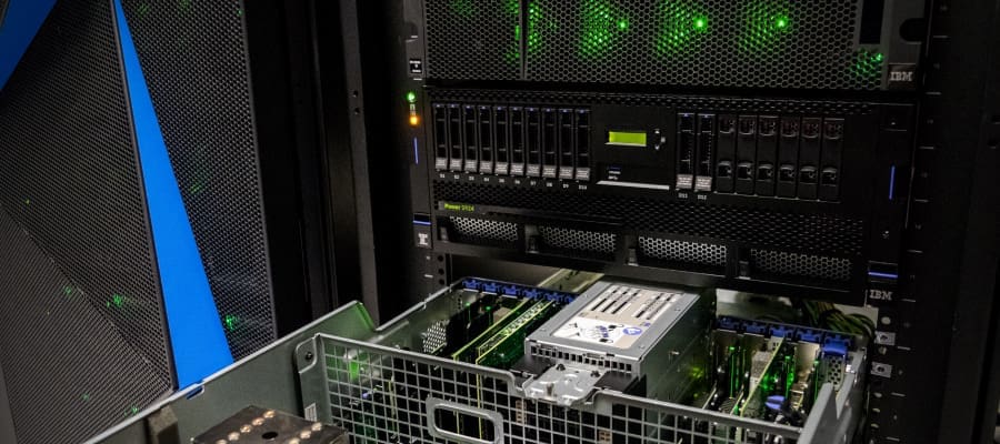 An image of IBM equipment open in a data center rack