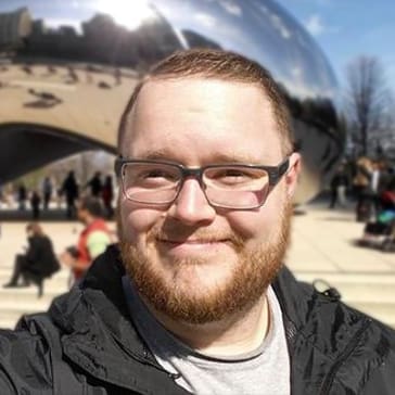 Man Wearing Glasses Smiles