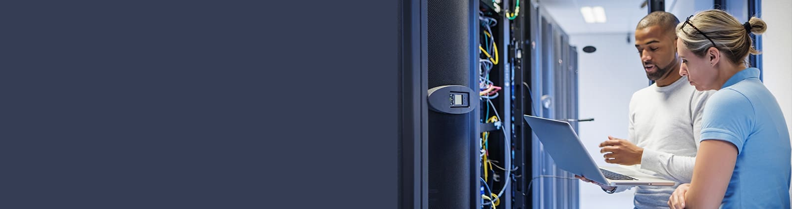 Two Professionals Talking, Holding Laptop