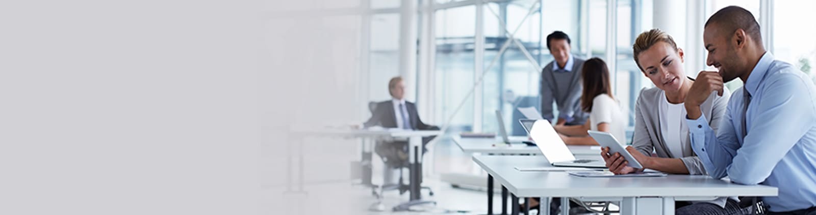 Two Professionals Looking at iPad, Thinking