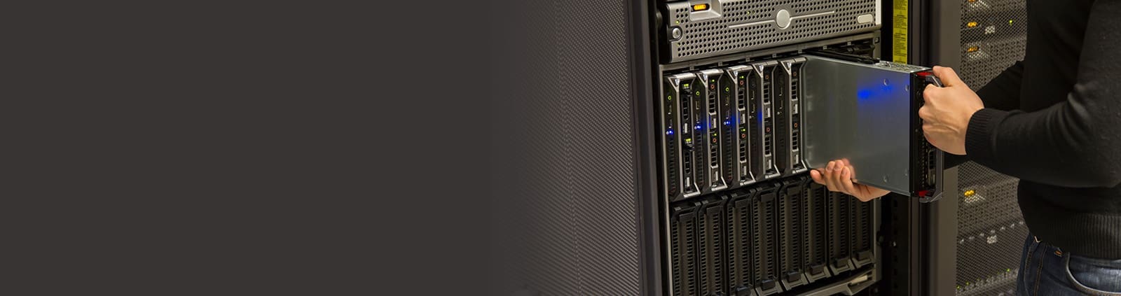 Close-Up Engineer Inserting Part into Server