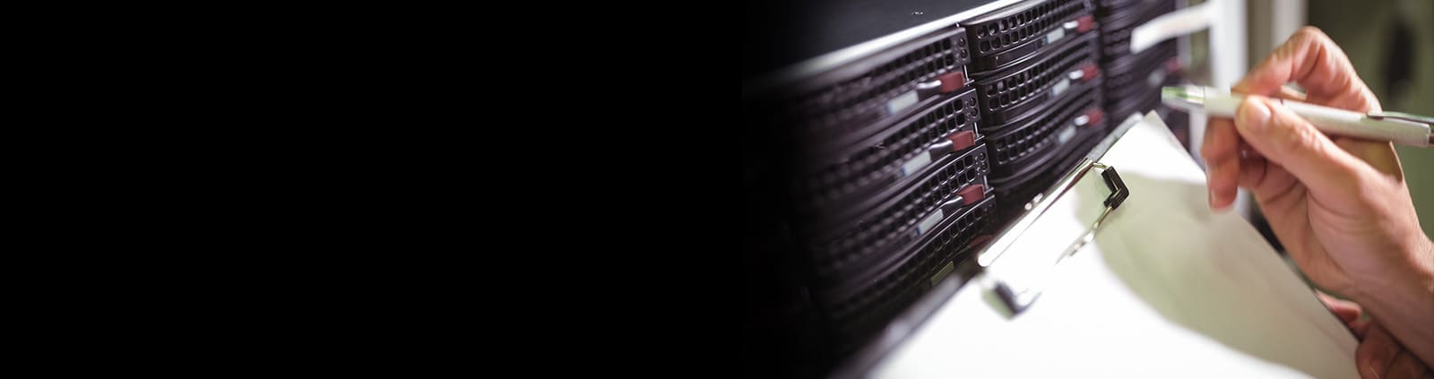 Up Close Hand Holding Pen Near Servers