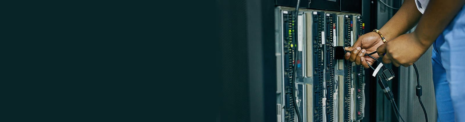 Hands Plugging in Networking Wire