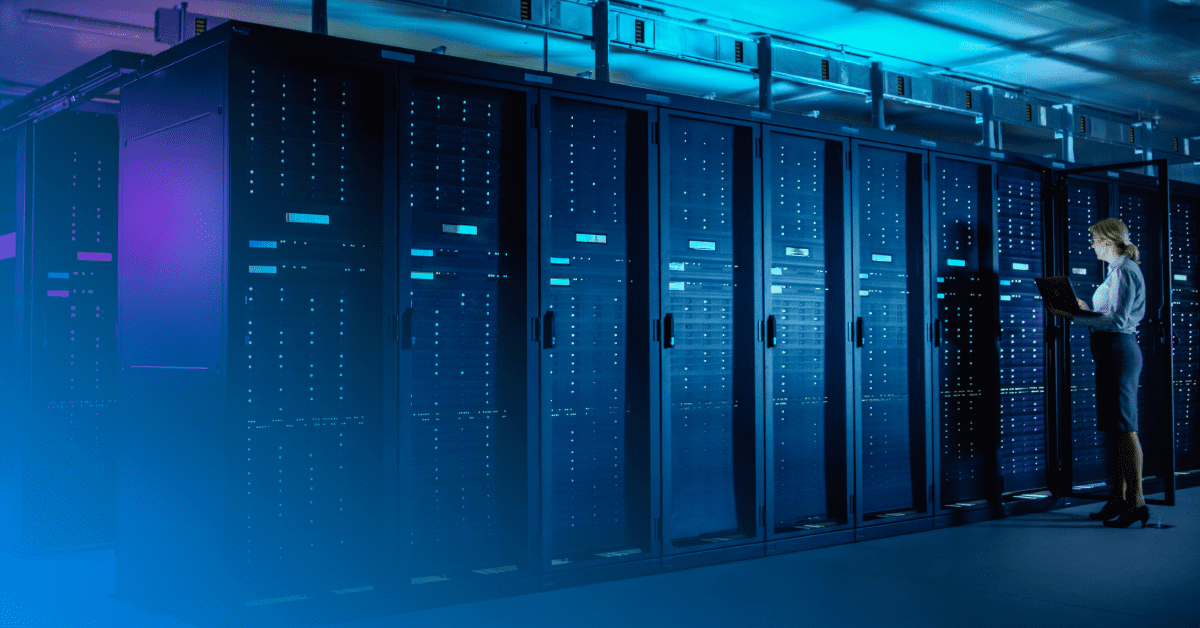 woman standing in data center with a computer with a blue gradient overlay