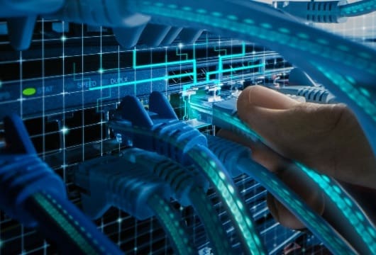 IT Administrator Plugs in Internet Connector into LAN Router Switch