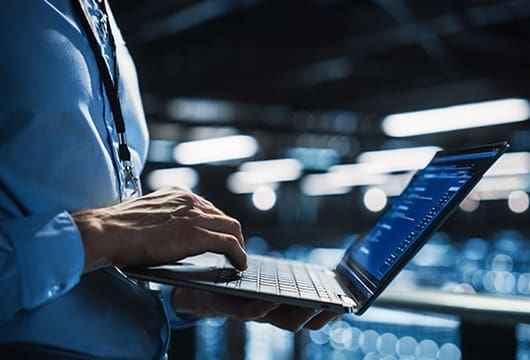 Man Typing On Computer Data Center