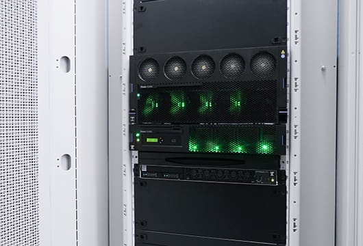 A close up image of the blinking lights on equipment in an equipment rack