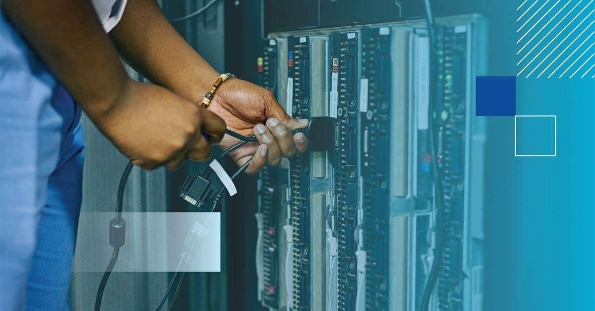 Hands Plugging in Networking Wire