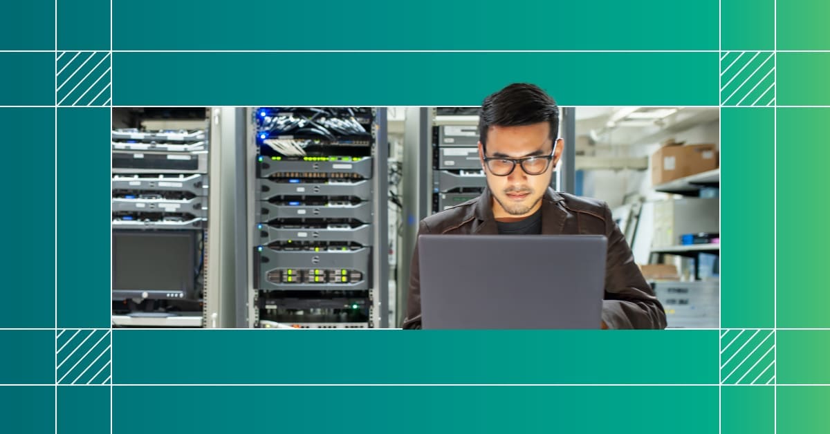 An image of an engineer on a laptop in a data center