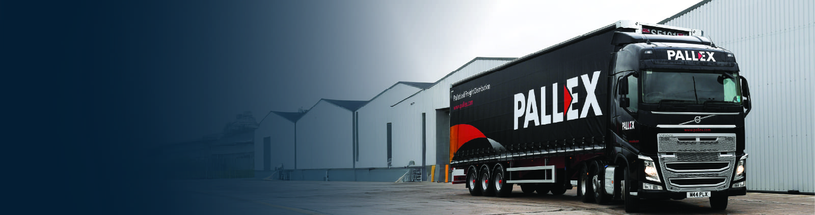 An image of Pall-Ex truck out side of a warehouse