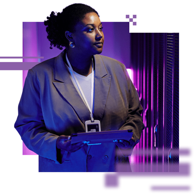 A business woman in a data center holding a tablet, looking to the right inspecting the equipment