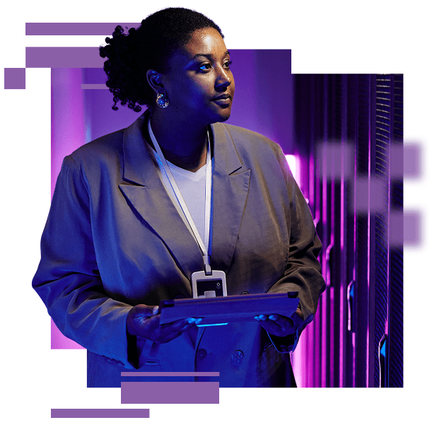 A business woman in a data center holding a tablet, looking to the right inspecting the equipment